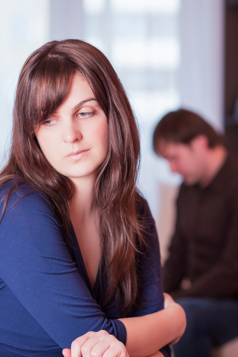 Family Problems. Couple Sitting Separated With Each Other in Different Parts of The Room. Depressed Feeling. Vertical Image